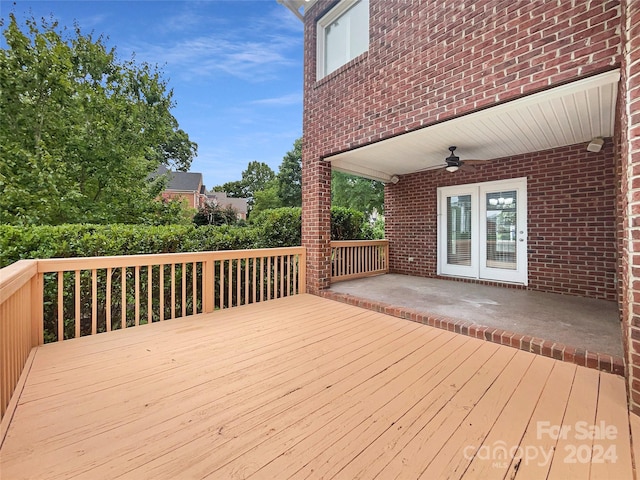 wooden deck featuring ceiling fan