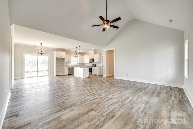 unfurnished living room featuring high vaulted ceiling, ceiling fan with notable chandelier, and light wood-type flooring