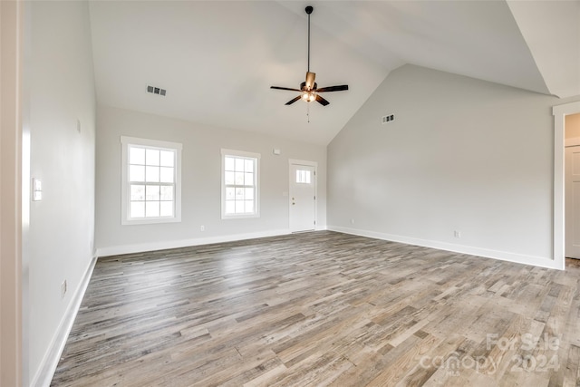 spare room featuring ceiling fan, high vaulted ceiling, and light hardwood / wood-style flooring