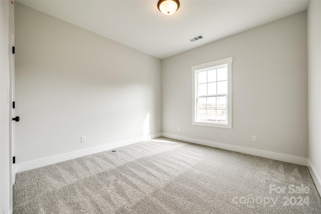 spare room featuring carpet