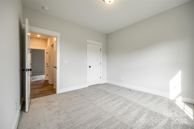 unfurnished bedroom featuring carpet flooring