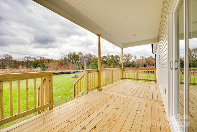 deck featuring a yard