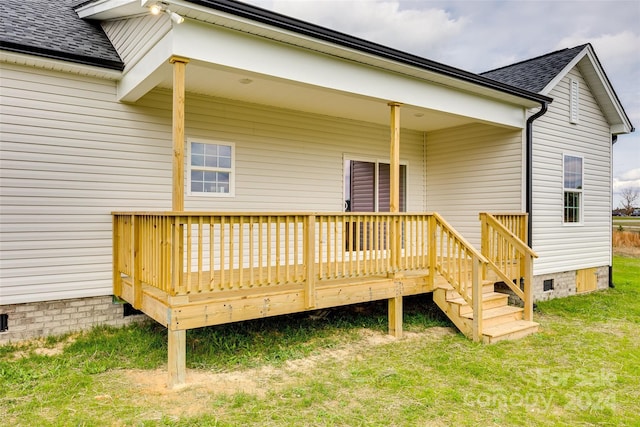 back of house with a yard and a wooden deck