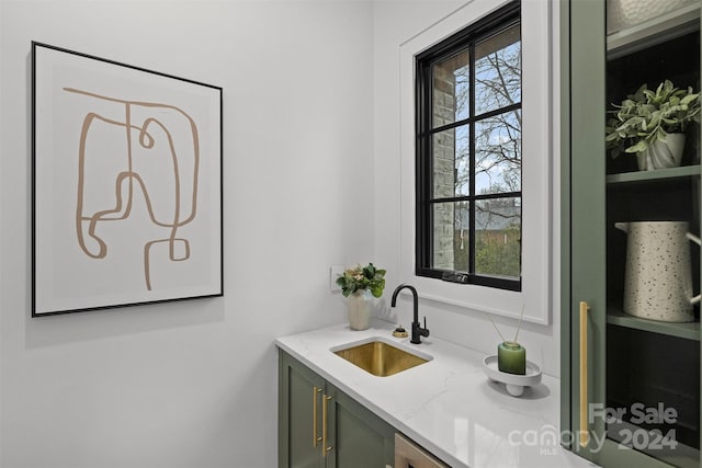 bathroom featuring a wealth of natural light and vanity