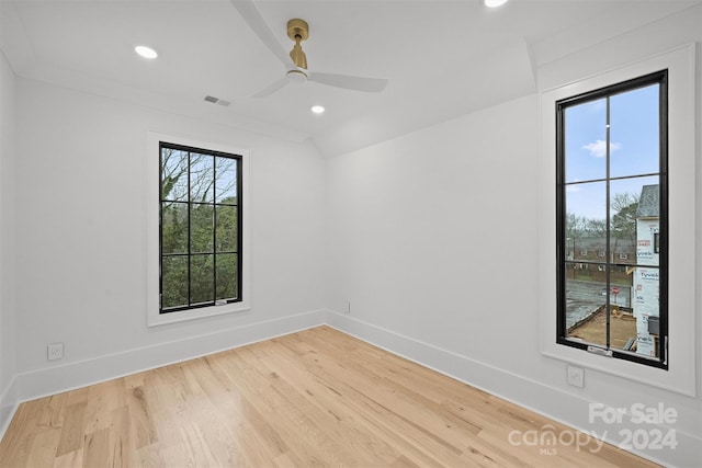 unfurnished room featuring light hardwood / wood-style flooring, a healthy amount of sunlight, and ceiling fan