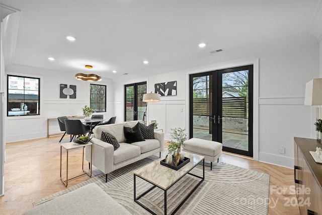 living room with french doors and light parquet flooring