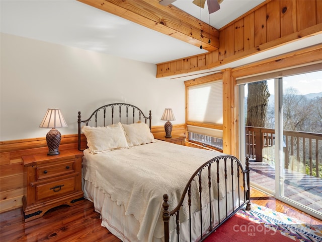 bedroom with ceiling fan, dark hardwood / wood-style floors, and access to outside