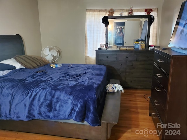 bedroom with hardwood / wood-style floors