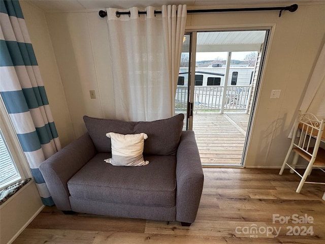 sitting room featuring a healthy amount of sunlight and light hardwood / wood-style flooring