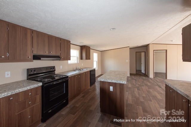 kitchen with dark hardwood / wood-style floors, electric range, range hood, a textured ceiling, and a center island