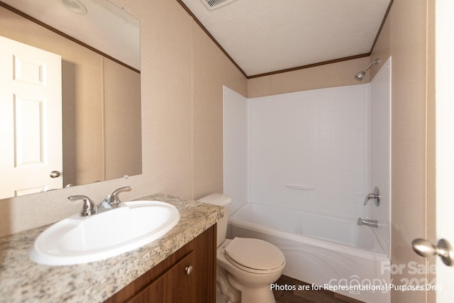 full bathroom featuring a textured ceiling, toilet, large vanity, and shower / bath combination