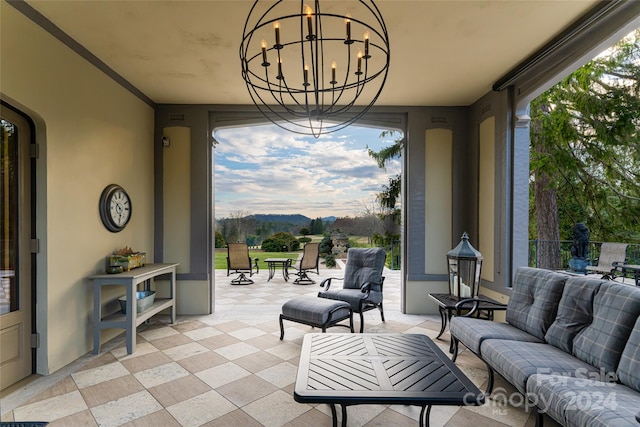 view of patio / terrace with a mountain view and an outdoor hangout area