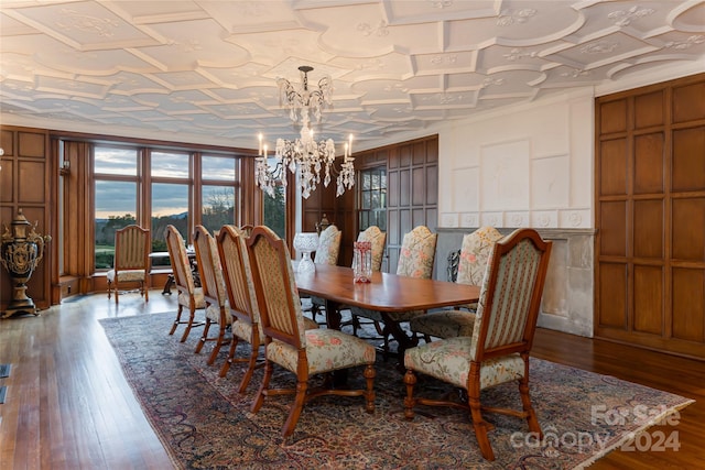 dining room with a chandelier and hardwood / wood-style floors