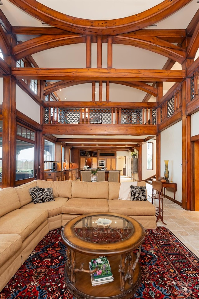 living room featuring a high ceiling