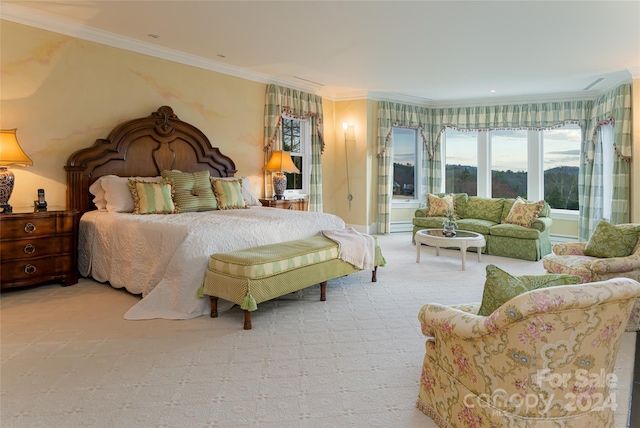 carpeted bedroom with ornamental molding