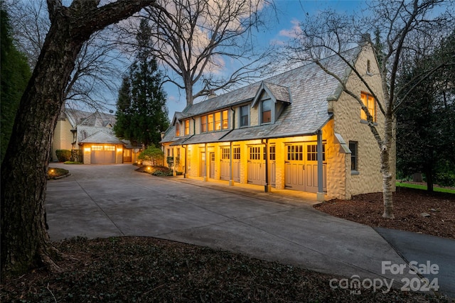 view of front facade with covered porch and a garage