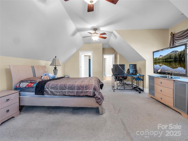 bedroom with vaulted ceiling, light colored carpet, and ceiling fan