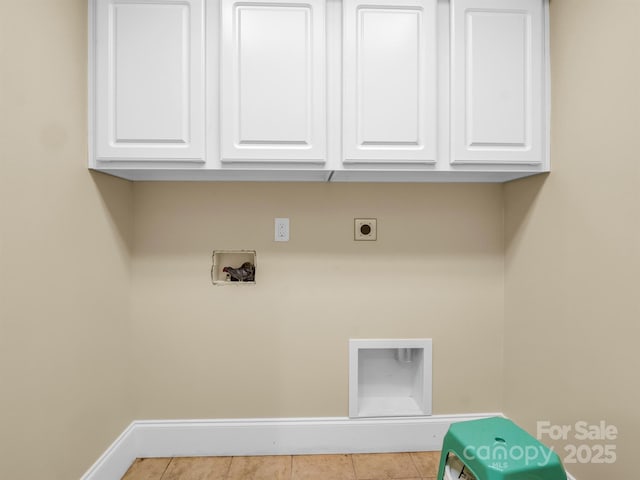 laundry area with cabinets, hookup for an electric dryer, hookup for a washing machine, and light tile patterned floors