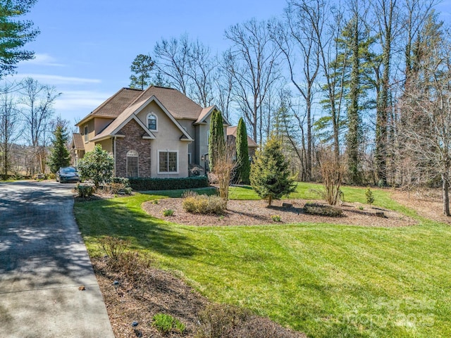 view of side of property featuring a lawn