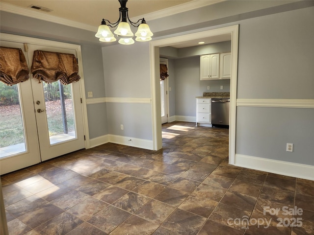 unfurnished dining area featuring french doors, ornamental molding, and a chandelier