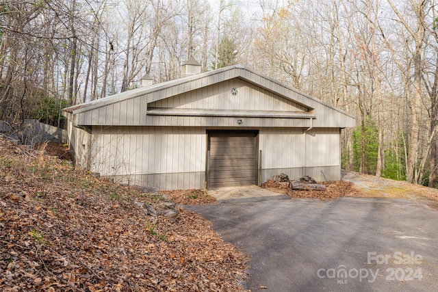 view of front of property with an outbuilding and a garage