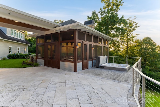 exterior space featuring a patio and a sunroom