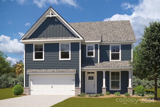 view of front facade with a front yard and a garage