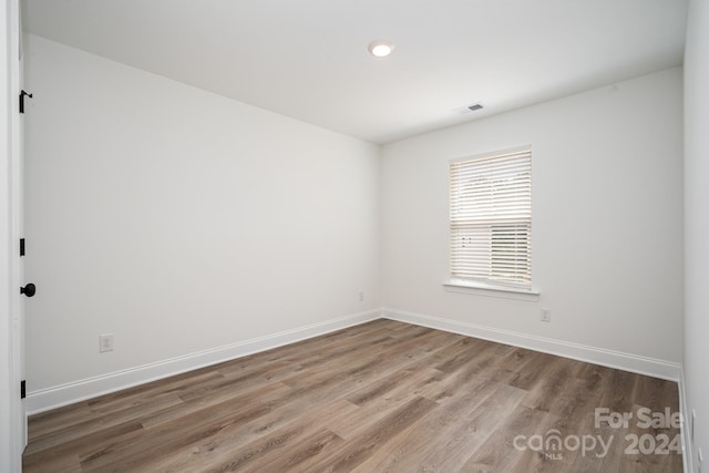 empty room featuring hardwood / wood-style floors