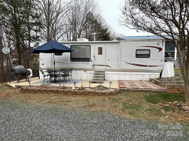 back of house with a patio