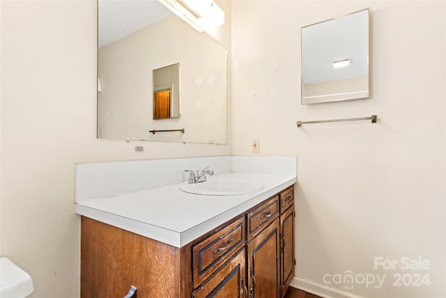 bathroom with vanity and a textured ceiling