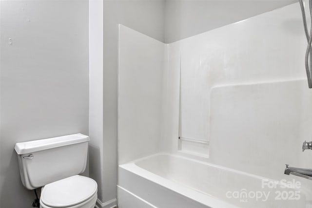 full bathroom with washtub / shower combination and toilet
