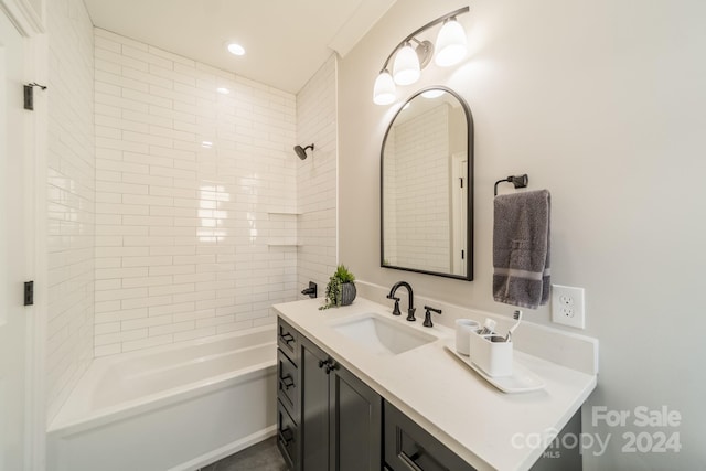 bathroom with vanity and tiled shower / bath combo