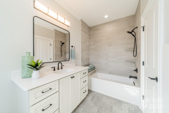 bathroom featuring vanity and tiled shower / bath combo