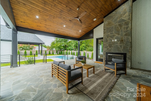 view of patio / terrace featuring ceiling fan, a fenced in pool, and an outdoor hangout area