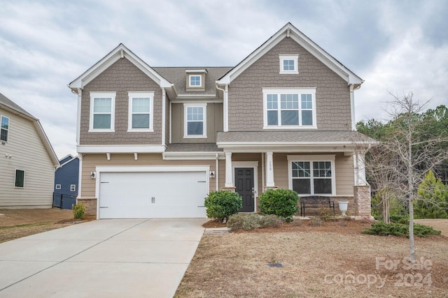 craftsman inspired home with a garage