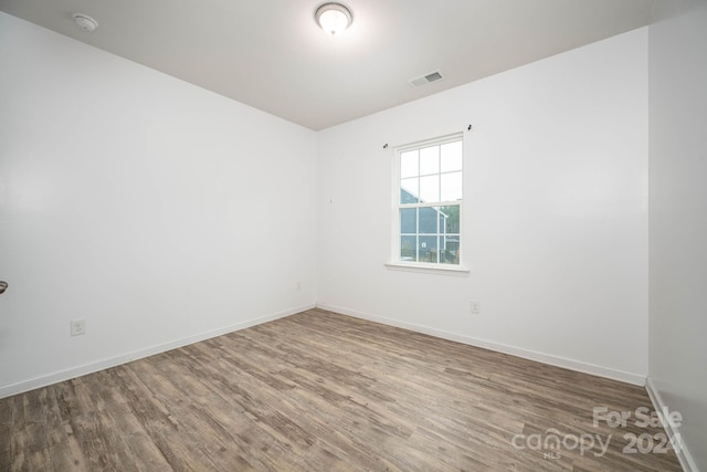 spare room featuring dark hardwood / wood-style flooring