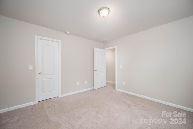 empty room with light colored carpet