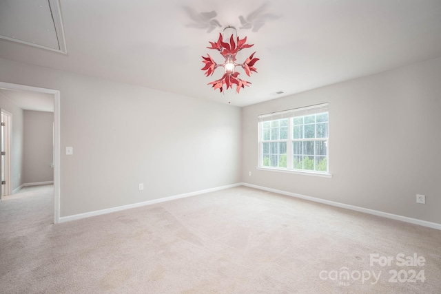 empty room featuring light carpet