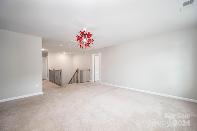 empty room featuring light colored carpet