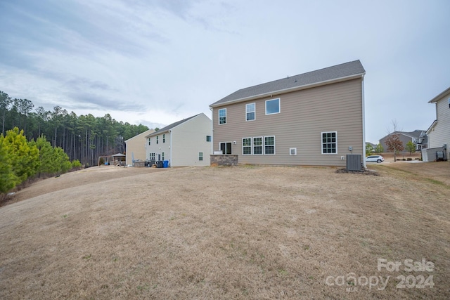 rear view of property with central air condition unit