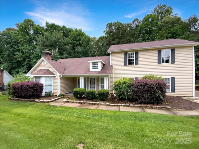 7210 Morningdew Ct, Denver, NC 28037 - view of front of home with a front lawn and a chimney