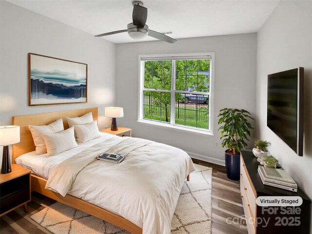 7210 Morningdew Ct, Denver, NC 28037 - bedroom with wood finished floors, a ceiling fan, and baseboards