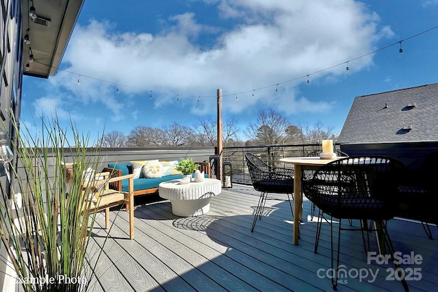 wooden deck featuring outdoor lounge area