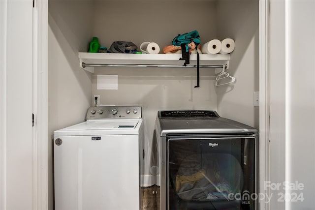 laundry area featuring washing machine and clothes dryer