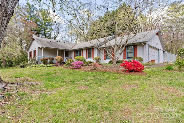 ranch-style home with a garage and a front yard