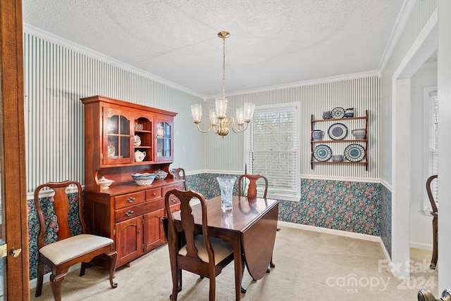 dining area with light colored carpet, ornamental molding, a chandelier, and a textured ceiling