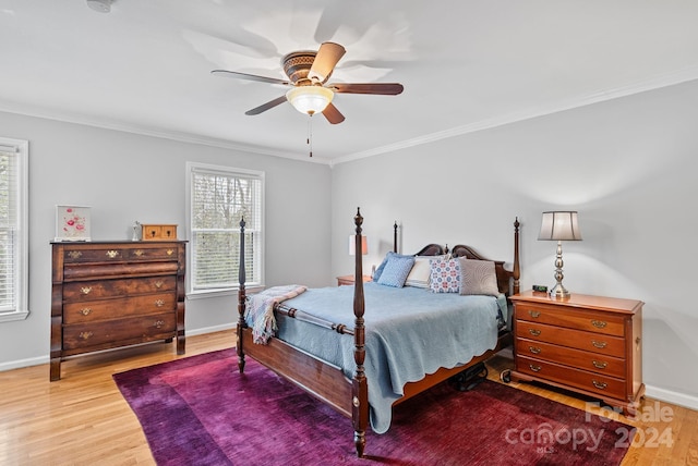 bedroom featuring wood-type flooring, ceiling fan, and ornamental molding