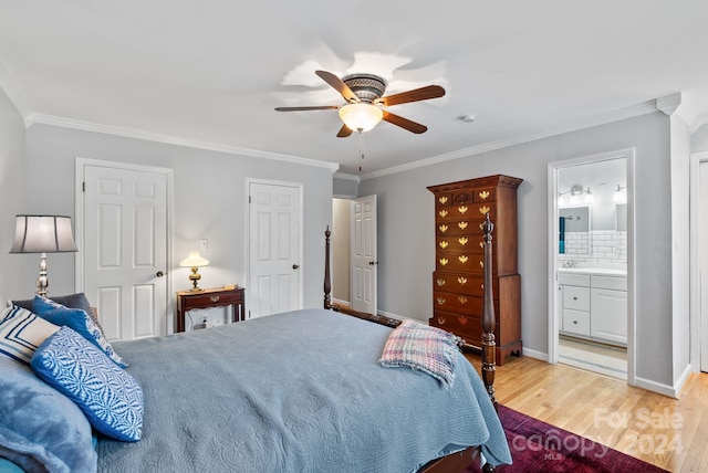 bedroom featuring crown molding, connected bathroom, ceiling fan, and light wood-type flooring