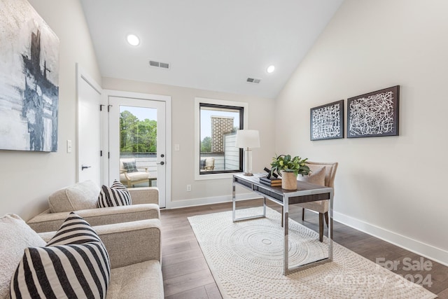 home office featuring dark hardwood / wood-style flooring and lofted ceiling