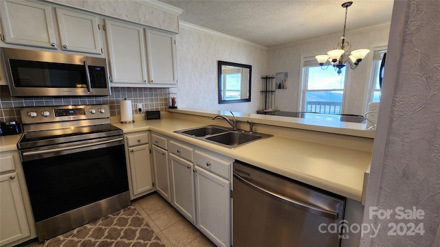 kitchen with hanging light fixtures, a notable chandelier, sink, stainless steel appliances, and light tile floors